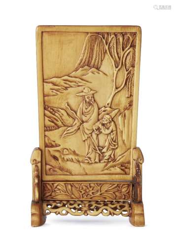 A Chinese ivory miniature table screen, late 19th century, carved in low relief with a scholar and
