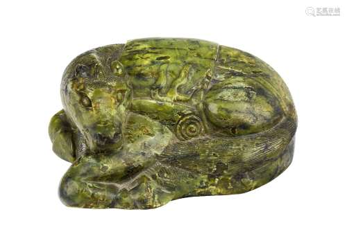 A Chinese spinach green hardstone horse, late Ming dynasty, carved as a recumbent horse with