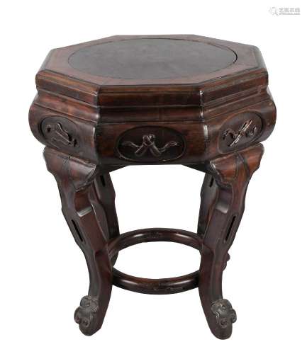A Chinese hongmu octagonal jardinière stand, late 19th century, carved to the frieze with the