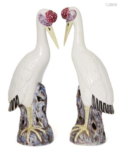 A pair of Chinese porcelain models of cranes, late Qing dynasty/Republic period, each modelled