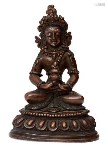 A Sino-Tibetan copper alloy figure of Avalokitesvara, early 20th century, seated in dhyanasana on