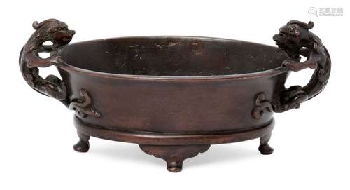 A Chinese bronze oval censer, apocryphal Xuande mark, 16th/17th century, cast with two chi-long