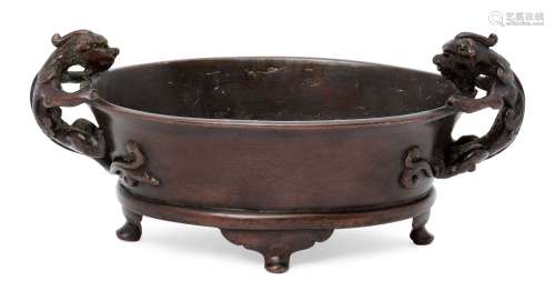 A Chinese bronze oval censer, apocryphal Xuande mark, 16th/17th century, cast with two chi-long