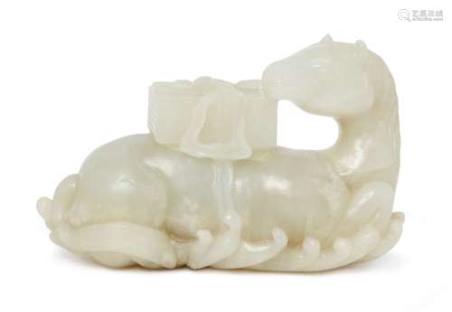 A fine Chinese white jade carving of a horse, 18th century, carved in recumbent pose on crested