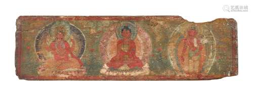 A Tibetan painted wood manuscript cover, 16th/17th century, decorated with three incarnations of
