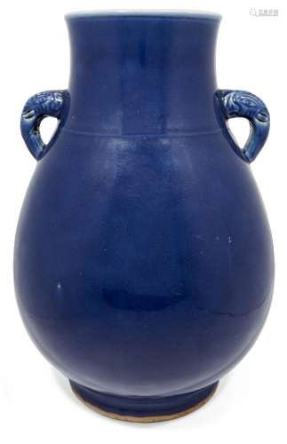 A large Chinese monochrome porcelain vase, hu, 19th century, with allover powder blue glaze, and