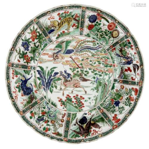 A large Chinese porcelain famille verte charger, Kangxi period, painted to the central reserve