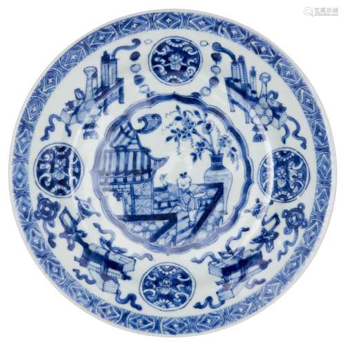 A Chinese porcelain dish, Kangxi period, painted in underglaze blue to the central reserve with a