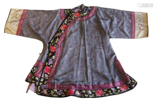A Chinese silk brocade coat, early 20th century, the trim embroidered with birds and floral