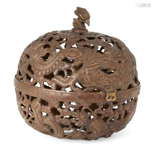 A Chinese copper alloy spherical repousse lantern, late Qing dynasty, with phoenix-head finial and