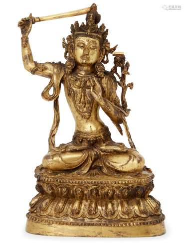 A Sino-Tibetan gilt bronze figure of Manjushri, late 19th century, seated in vajrasana on a lotus