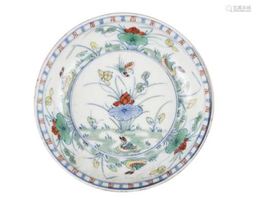 A Chinese porcelain doucai 'lotus pond' dish, Kangxi, the interior delicately enamelled with a