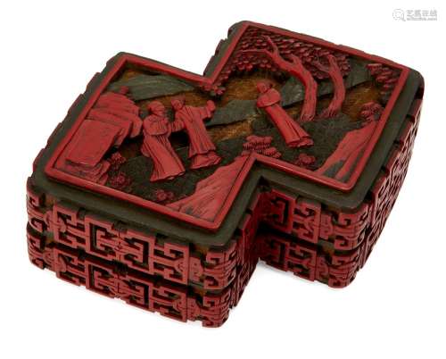 A Chinese three-colour cinnabar lacquer lozenge shaped box, early 19th century, the cover carved