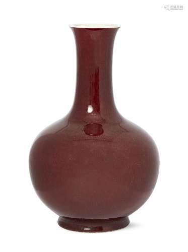 A Chinese porcelain sang-de-boeuf bottle vase, Qianlong mark, early 20th century, the body covered