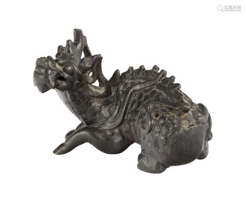 A Chinese bronze qilin weight, Ming dynasty, modelled in recumbent pose, 12cm longSlight wear, but