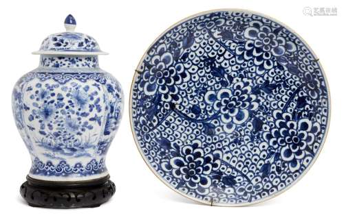 A Chinese export porcelain dish, 18th century, painted in underglaze blue with peony sprays on a