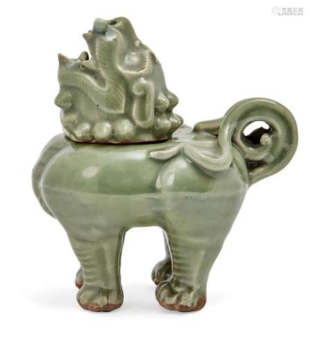 A Japanese celadon censer, early 20th century, modelled as a Buddhist lion, with head tilted