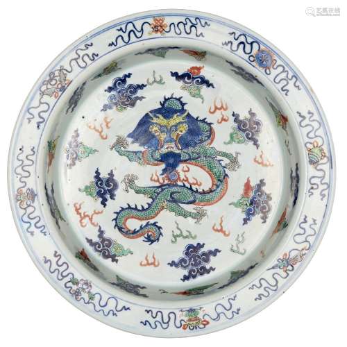 A Chinese porcelain wucai basin, Wanli mark, 18th century, painted to the central reserve with a
