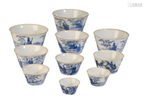 SET OF NINE BLUE AND WHITE 'SCHOLARS AND ATTENDANTS' GRADUATED WINE CUPS OR BOWLS