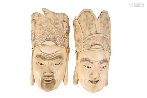 TWO CARVED IVORY MASKS