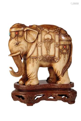 CARVED IVORY FIGURE OF AN ELEPHANT