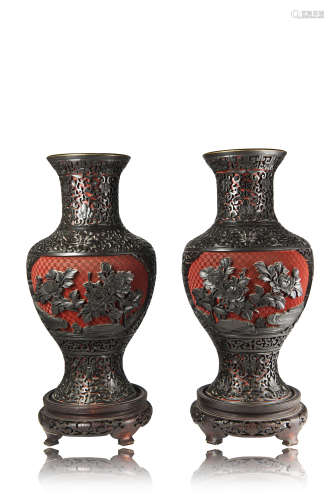 A pair of lacquer vases, the black carved floral decoration reserved on a cinnabar groundChina, 19th