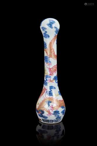 A blue and white and polychrome porcelain fly whisk handle decorated with dragons amongst clouds,