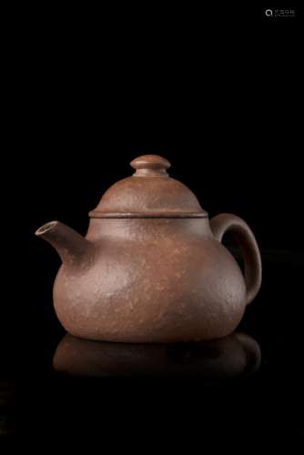 A yixing pottery teapot and cover, signed Meng Chen, with apocryphal Tianqi ding mao markChina, 19th