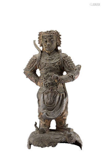 A bronze model of a warrior wearing an armor and standing on a base with clouds and a dragonChina,