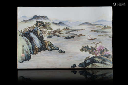 A rectangular porcelain plaque painted with a landscape scene, with calligraphy and seal reading 