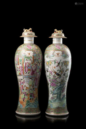A pair of Cantonese Famille Rose baluster vases decorated with figures and floral motifs (defects)
