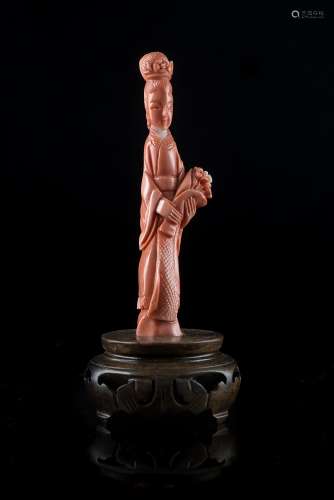 A small coral carving of a lady carrying flowersChina, early 20th century(h. 11.5 cm.; net weight 53