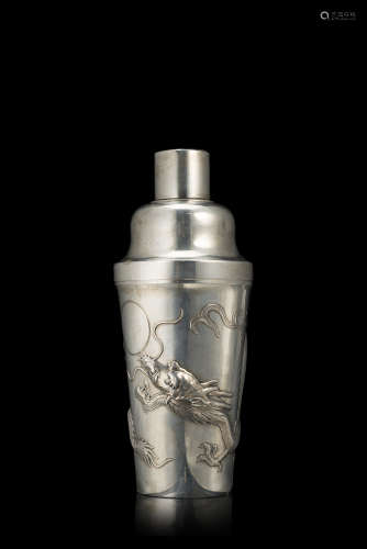 A silver-export cocktail shaker decorated with dragons against a matted ground, marked Guang