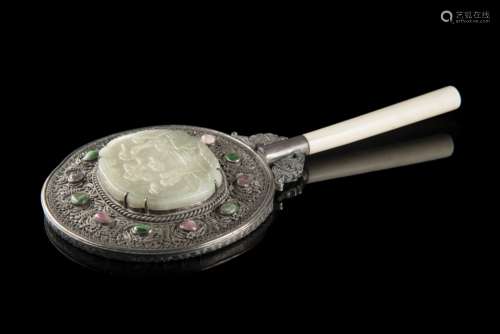 A silver mirror with an ivory handle, decorated with a celadon plaque incised with figures in a