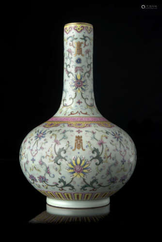 A celadon-ground Famille Rose porcelain bottle vase decorated with stylised lotus flowers and leaves