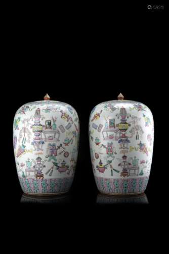 A pair of Famille Rose ovoid vases and covers decorated with the 'hundred antiques' (defects)