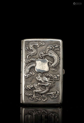 A silver-export cigarette-holder decorated with dragons and bamboo and incised with a