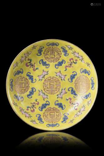 A yellow-ground Famille Rose dish decorated with shou characters, peaches and bats, Tongzhi four