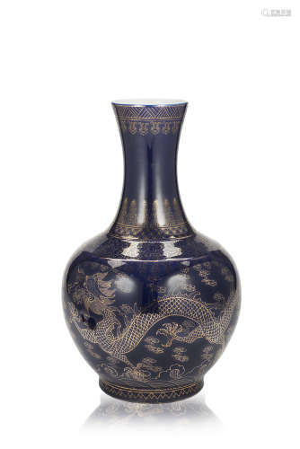 A powder-blue bottle vase with gilt decoration of dragons, with an apocryphal Guangxu seal mark to