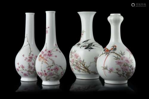 A group of four porcelain vases decorated with flowers and calligraphy, three with Jingdezhen