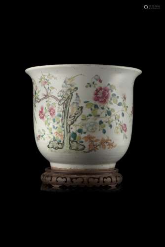 A Famille Rose vase, decorated with floral motifs, wood baseChina, 19th century(d. max 36.5 cm.)