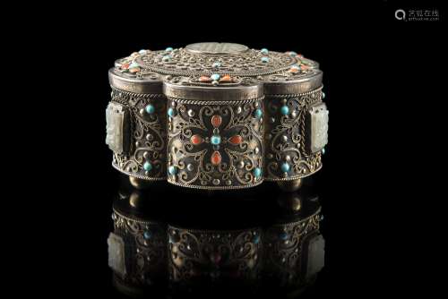 A silver box and cover decorated with inset turquoise and four small plaques of celadon jade (