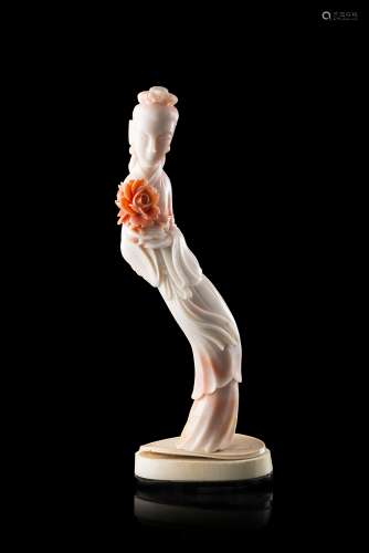 A pale pink coral carving of a lady wearing long robes, with a bone base (slight defects)China,