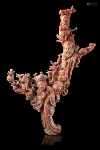 A coral branch carved with legendary figures and deities amongst flowering branches (defects)