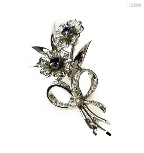 A sapphire and diamond spray brooch