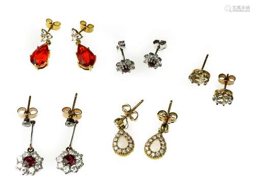 A collection of five pairs of earrings