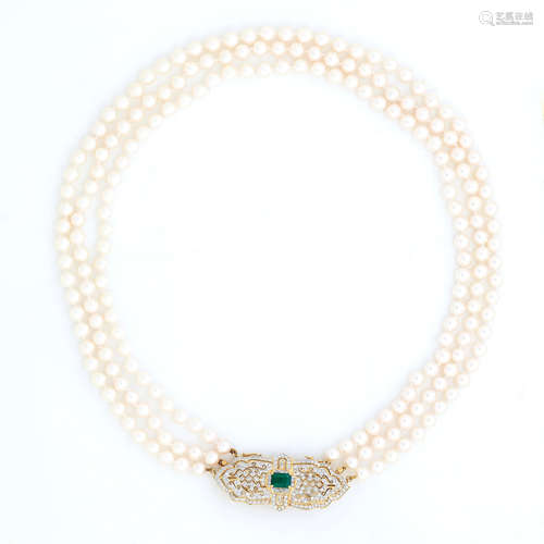 A cultured pearl necklace with an emerald and diamond clasp/brooch