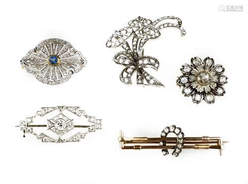 A collection of diamond brooches