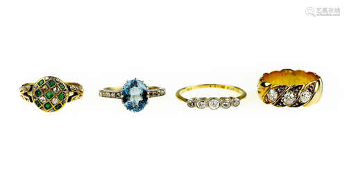 A collection of four gem-set rings