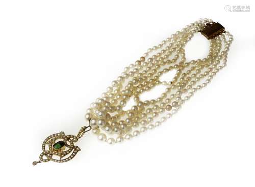 A cultured pearl choker with a gem-set pendant